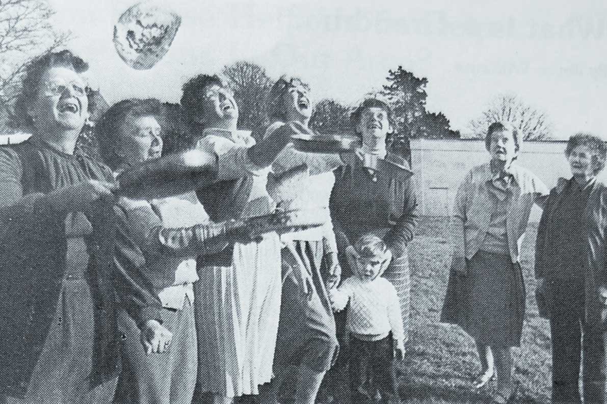 Seen here at the annual Pancake Day coffee morning held by the Ladies' Guild at Longfields are the Guild's Catering Officers, Mrs. Amy Harris, Mrs. Margaret Grey, Mrs. Elsie Rowlands and Mrs Joyce Williams, all tossing pancakes, watched by Mrs. Joan Owen, Mrs Owen Davies and Mrs. Susan Phillips.